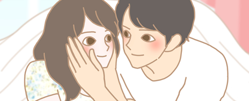 額をあわせて微笑みあう男女