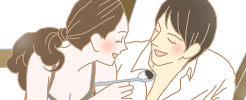 一緒に食事(カレー)を食べる男女