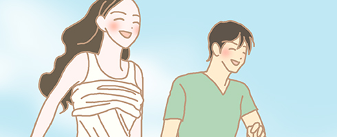 笑顔で会話をする男女