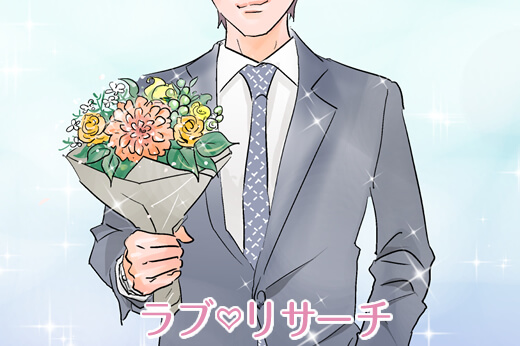 男性がスーツを着て立っている